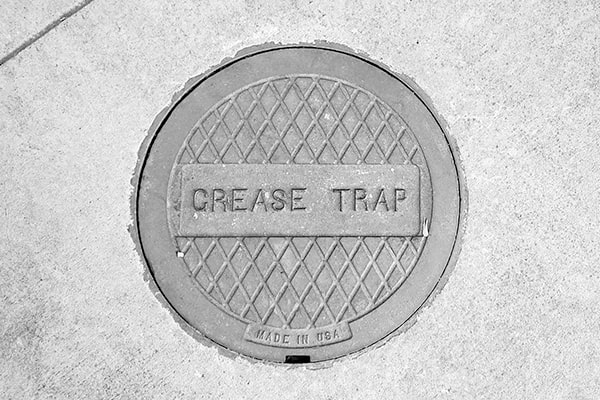 neglecting grease trap pumping can lead to clogs, backups, and even fines for non-compliance with environmental regulations